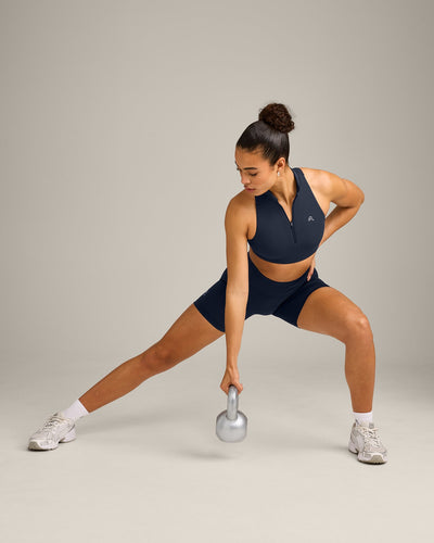 EasyLift™ Zip High Neck Sports Bra with Grey Logo | True Blue