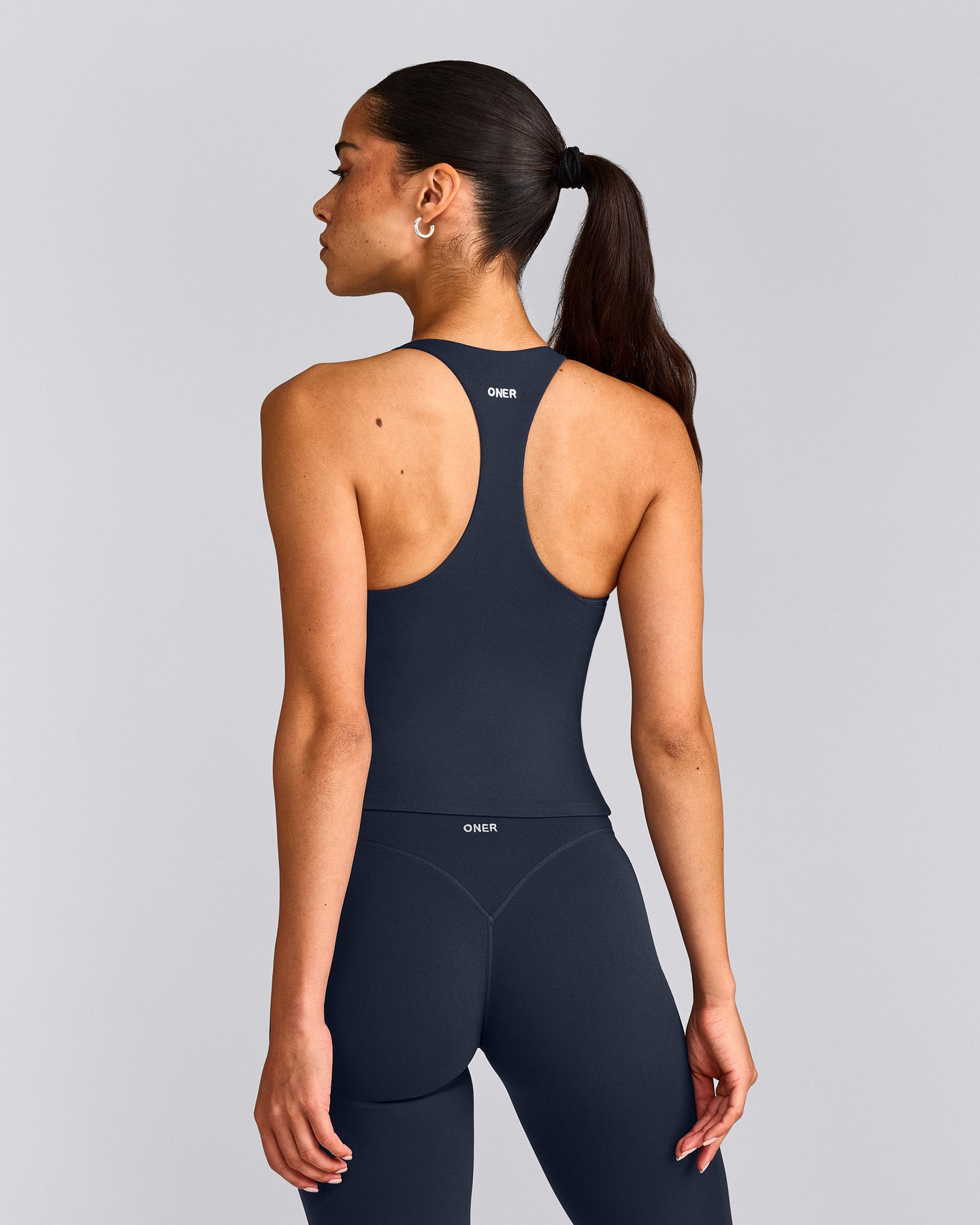 SoftMotion™ Racer Back Mid Tank Top with Built in Bra Shelf with Grey Logo | True Blue