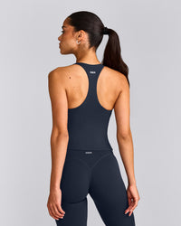 SoftMotion™ Racer Back Mid Tank Top with Built in Bra Shelf with Grey Logo | True Blue
