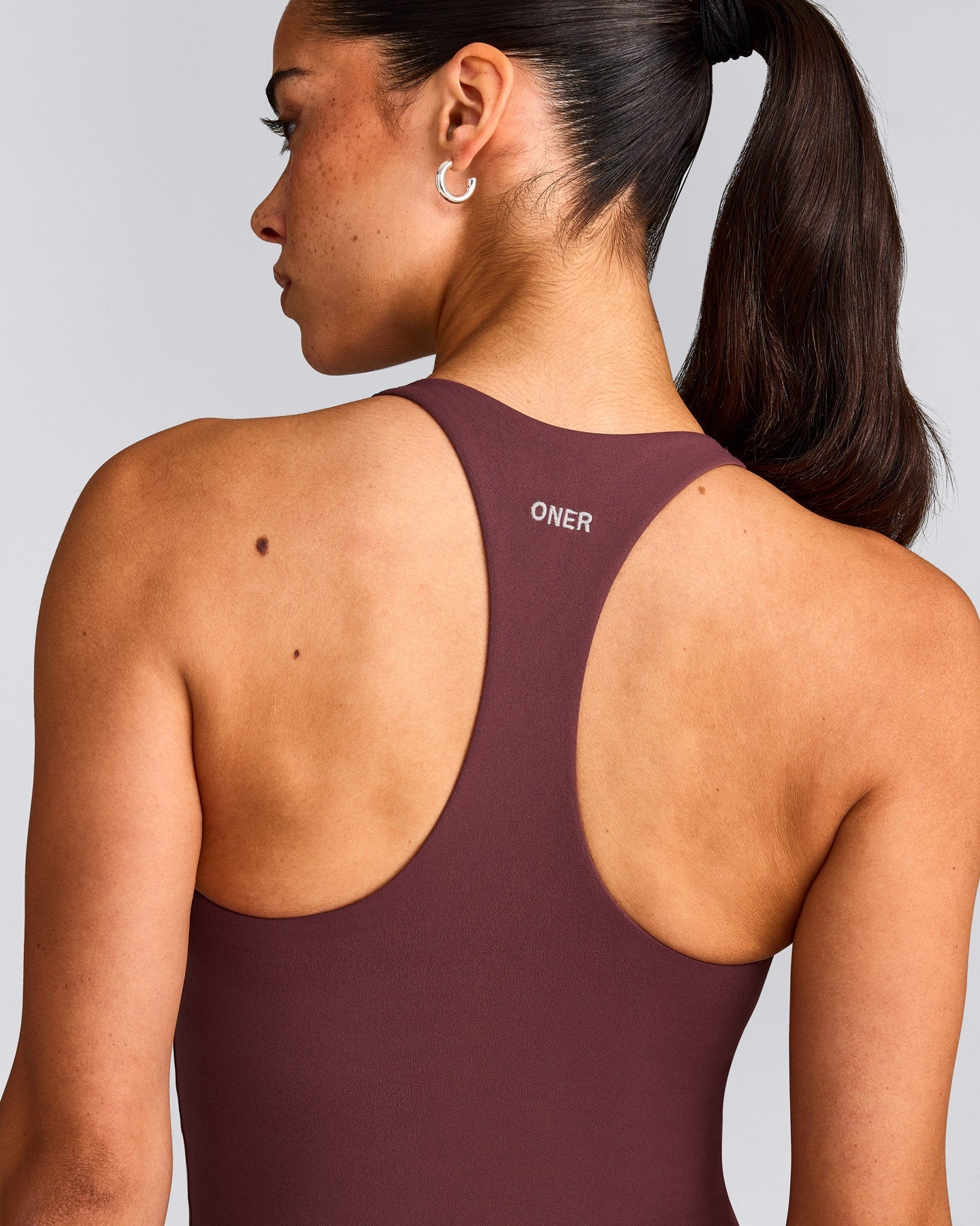 SoftMotion™ Racer Back Mid Vest with Built in Bra Shelf with Grey Logo | Velvet Mocha