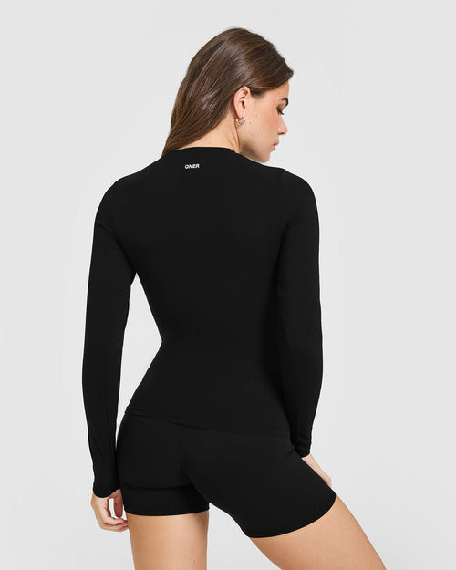 SoftMotion™ Long Sleeve Top with White Logo | Black