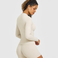 SoftMotion™ Long Sleeve Top with White Logo | Sand