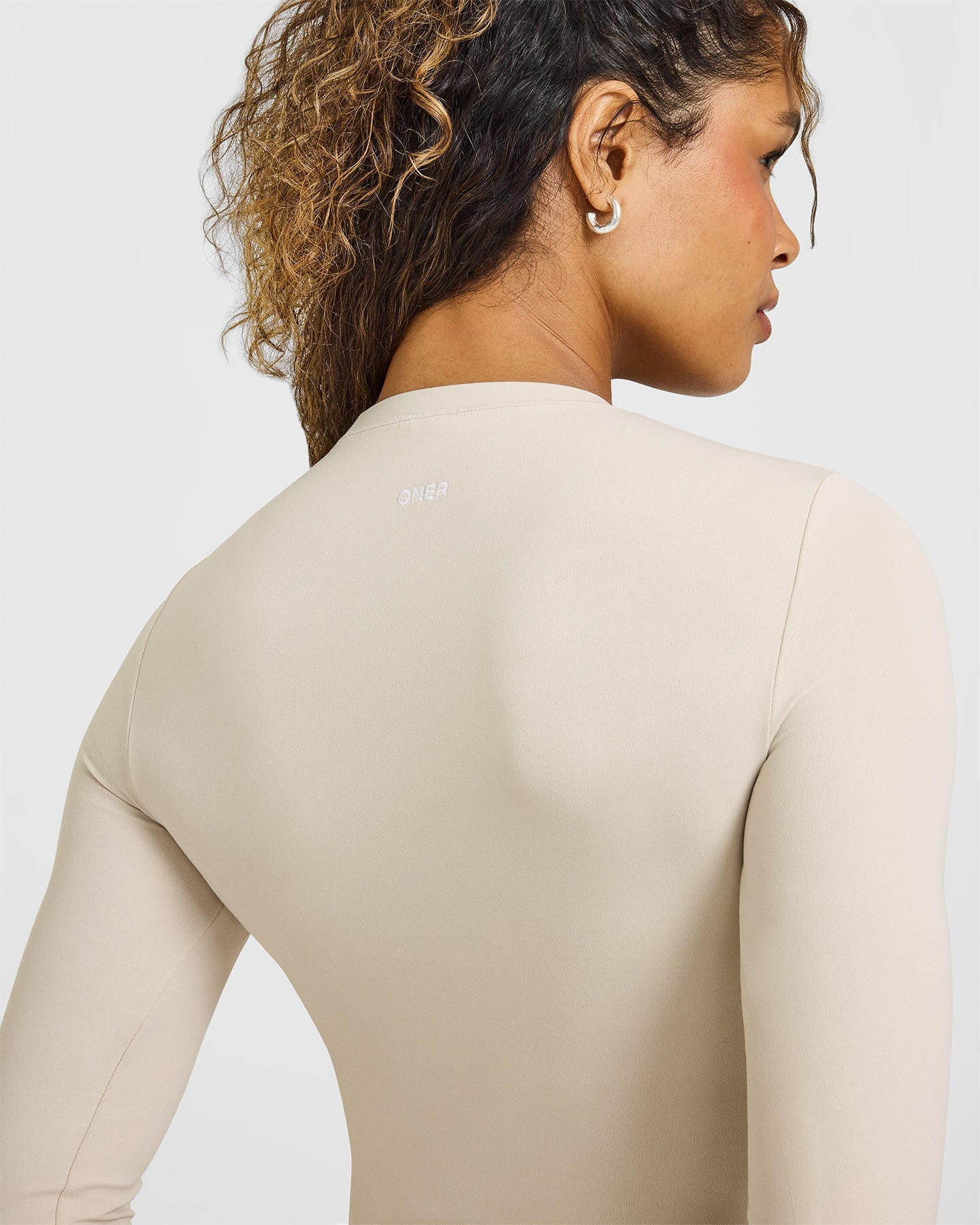 SoftMotion™ Long Sleeve Top with White Logo | Sand
