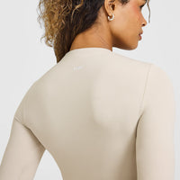 SoftMotion™ Long Sleeve Top with White Logo | Sand