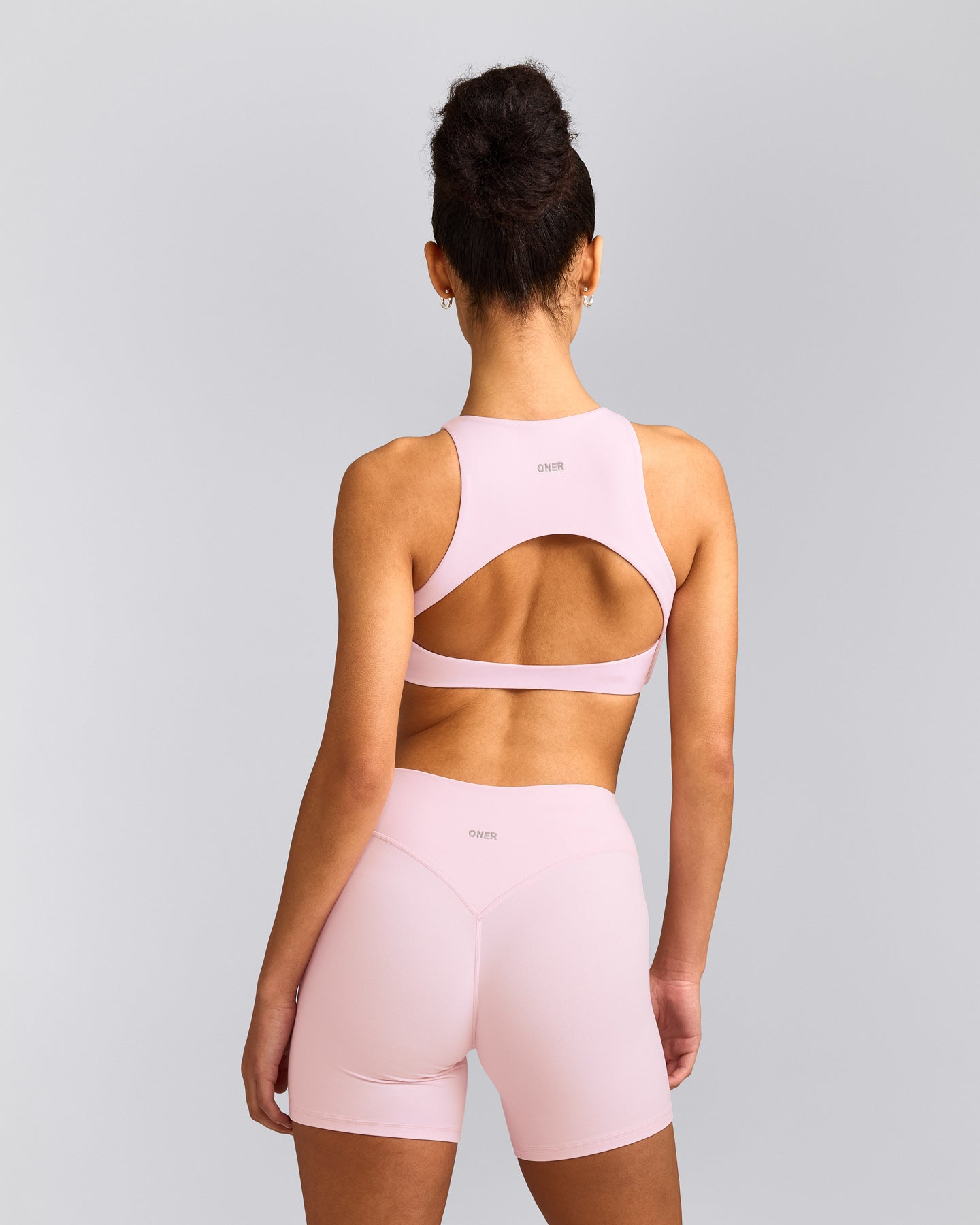 SoftMotion™ High Neck Sports Bra with Grey Logo | Soft Girl Pink