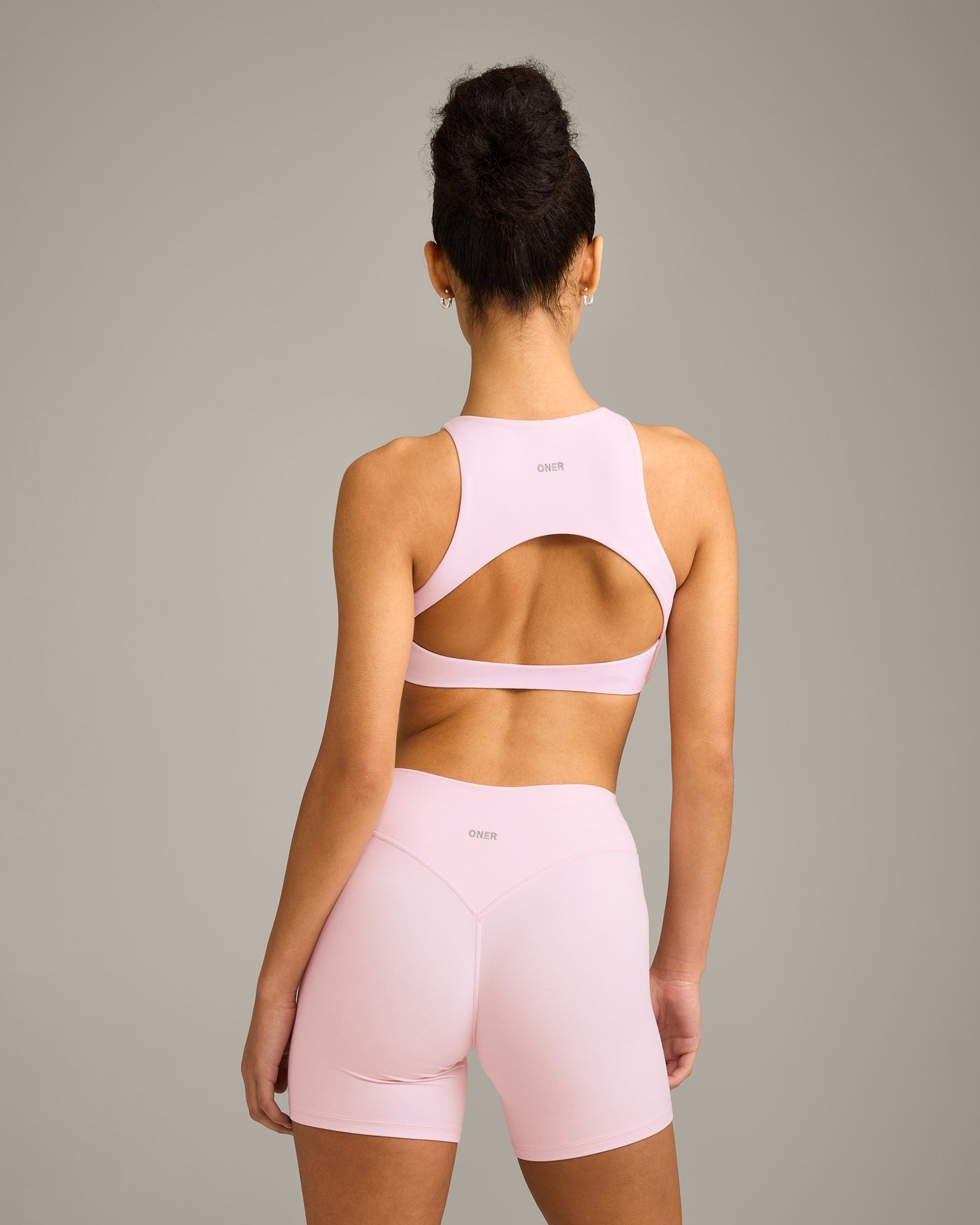 SoftMotion™ High Neck Sports Bra with Grey Logo | Soft Girl Pink