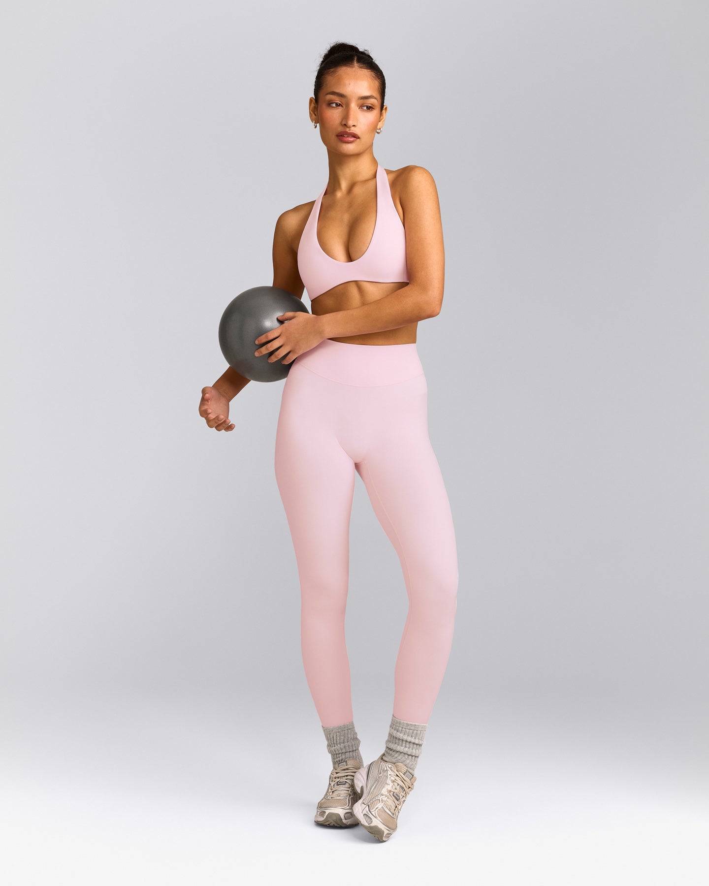 SoftMotion™ Minimal Halter Neck Bralette with Grey Logo | Soft Girl Pink