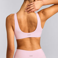SoftMotion™ Scoop Back Bralette with Grey Logo | Soft Girl Pink
