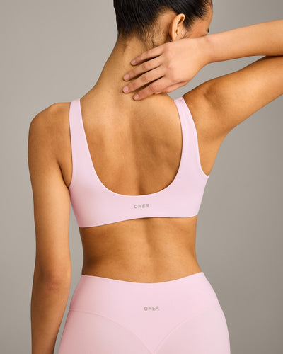 SoftMotion™ Scoop Back Bralette with Grey Logo | Soft Girl Pink