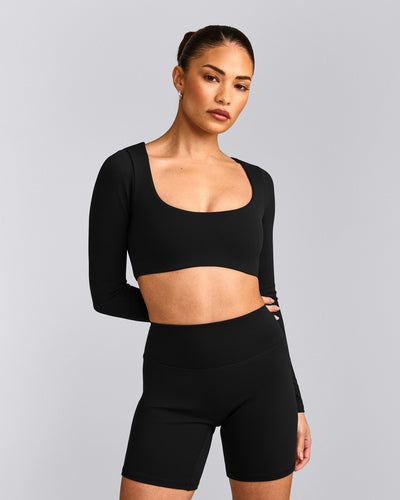 SoftMotion™ Scoop Neck Long Sleeve Crop Top with Built in Bra Shelf with Grey Logo | Black