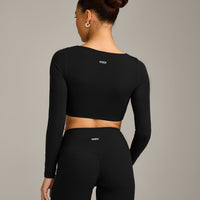 SoftMotion™ Scoop Neck Long Sleeve Crop Top with Built in Bra Shelf with Grey Logo | Black