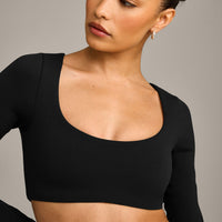 SoftMotion™ Scoop Neck Long Sleeve Crop Top with Built in Bra Shelf with Grey Logo | Black