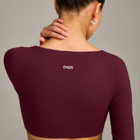 SoftMotion™ Scoop Neck Long Sleeve Crop Top with Built in Bra Shelf with Grey Logo | Cherry Lacquer Purple