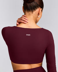 SoftMotion™ Scoop Neck Long Sleeve Crop Top with Built in Bra Shelf with Grey Logo | Cherry Lacquer Purple