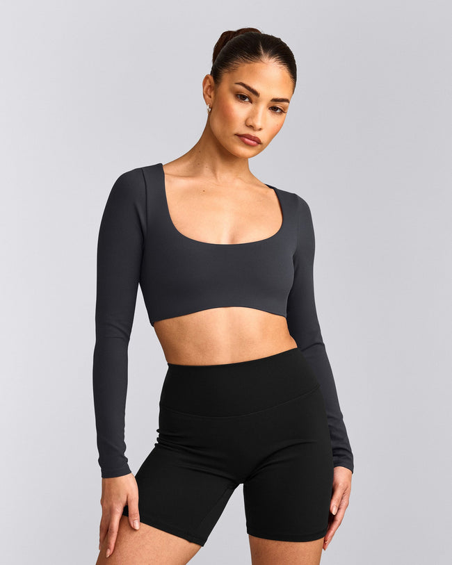 SoftMotion™ Scoop Neck Long Sleeve Crop Top with Built in Bra Shelf with Grey Logo | Coal