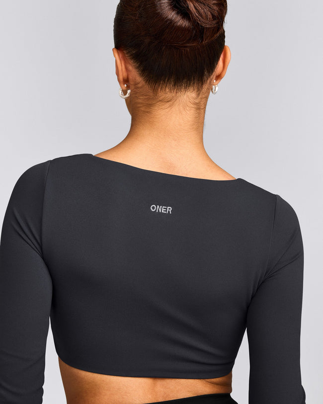 SoftMotion™ Scoop Neck Long Sleeve Crop Top with Built in Bra Shelf with Grey Logo | Coal