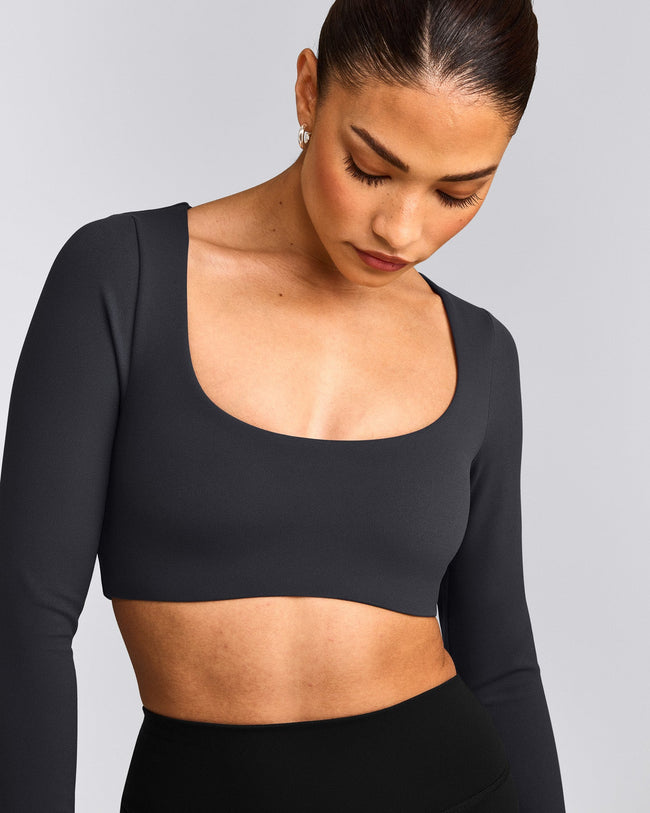 SoftMotion™ Scoop Neck Long Sleeve Crop Top with Built in Bra Shelf with Grey Logo | Coal