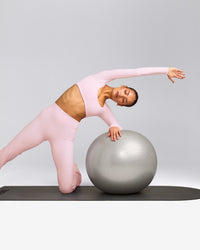 SoftMotion™ Scoop Neck Long Sleeve Crop Top with Built in Bra Shelf with Grey Logo | Soft Girl Pink