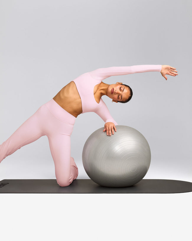 SoftMotion™ Scoop Neck Long Sleeve Crop Top with Built in Bra Shelf with Grey Logo | Soft Girl Pink