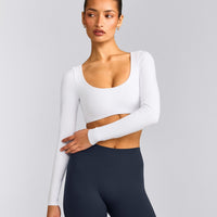 SoftMotion™ Scoop Neck Long Sleeve Crop Top with Built in Bra Shelf with Grey Logo | White