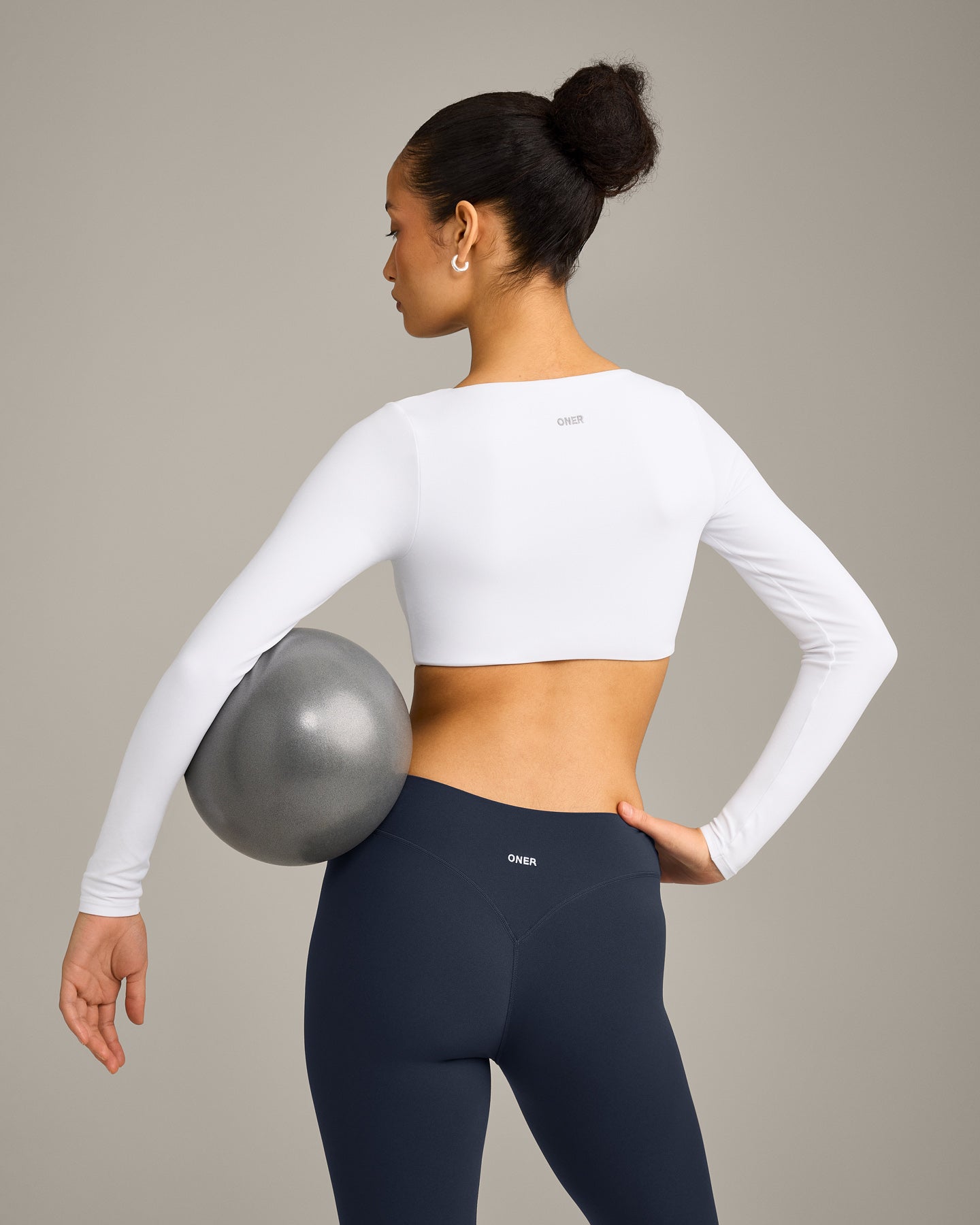 SoftMotion™ Scoop Neck Long Sleeve Crop Top with Built in Bra Shelf with Grey Logo | White
