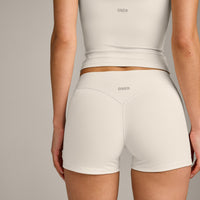 SoftMotion™ Double Layer Mid Rise Shorts 4" with Grey Logo | Marshmallow White