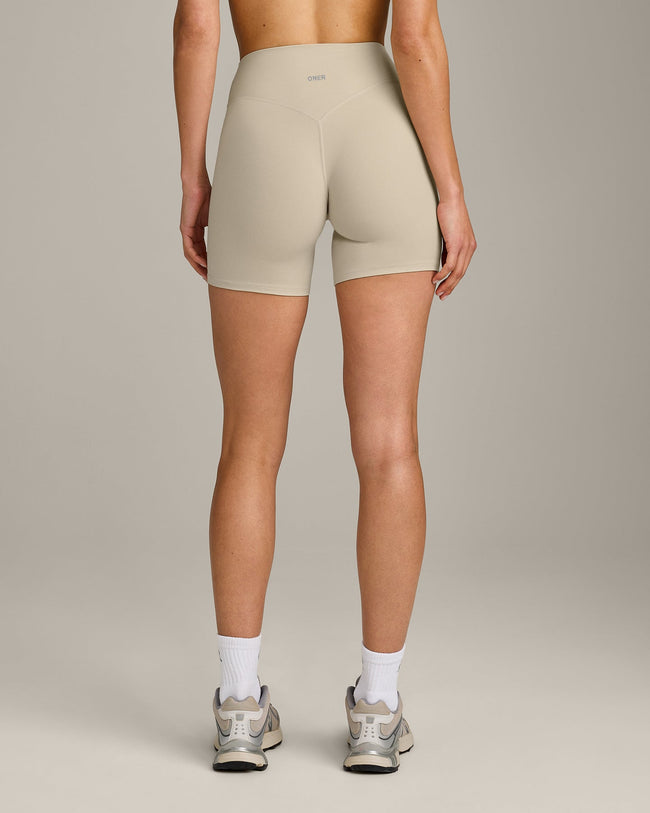 SoftMotion™ High Waisted Shorts 6" with Grey Logo | Oatmeal