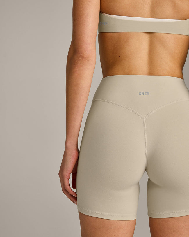 SoftMotion™ High Waisted Shorts 6" with Grey Logo | Oatmeal