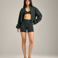 SoftMotion™ Minimal Halter Neck Bralette with Grey Logo | Emerald Noir