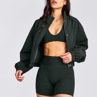SoftMotion™ Minimal Halter Neck Bralette with Grey Logo | Emerald Noir