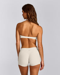 SoftMotion™ Minimal Halter Neck Bralette with Grey Logo | Marshmallow White