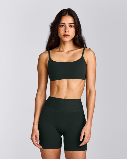 SoftMotion™ Strappy Sports Bra with Grey Logo | Emerald Noir