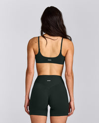 SoftMotion™ Strappy Sports Bra with Grey Logo | Emerald Noir