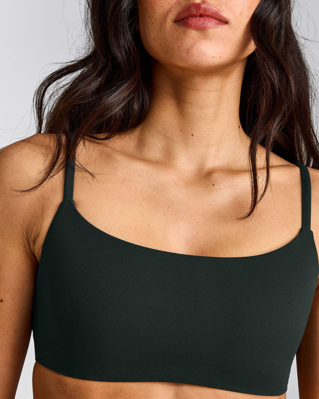SoftMotion™ Strappy Sports Bra with Grey Logo | Emerald Noir
