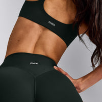 SoftMotion™ Strappy Sports Bra with Grey Logo | Emerald Noir