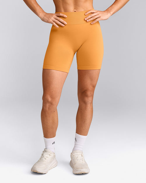 EffortlessLift™ Seamless Mid Rise Shorts with Grey Logo | Powdered Orange