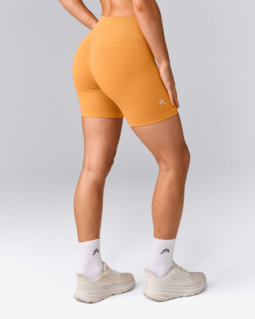 EffortlessLift™ Seamless Mid Rise Shorts with Grey Logo | Powdered Orange