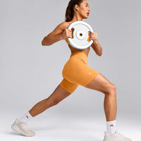 EffortlessLift™ Seamless Mid Rise Shorts with Grey Logo | Powdered Orange