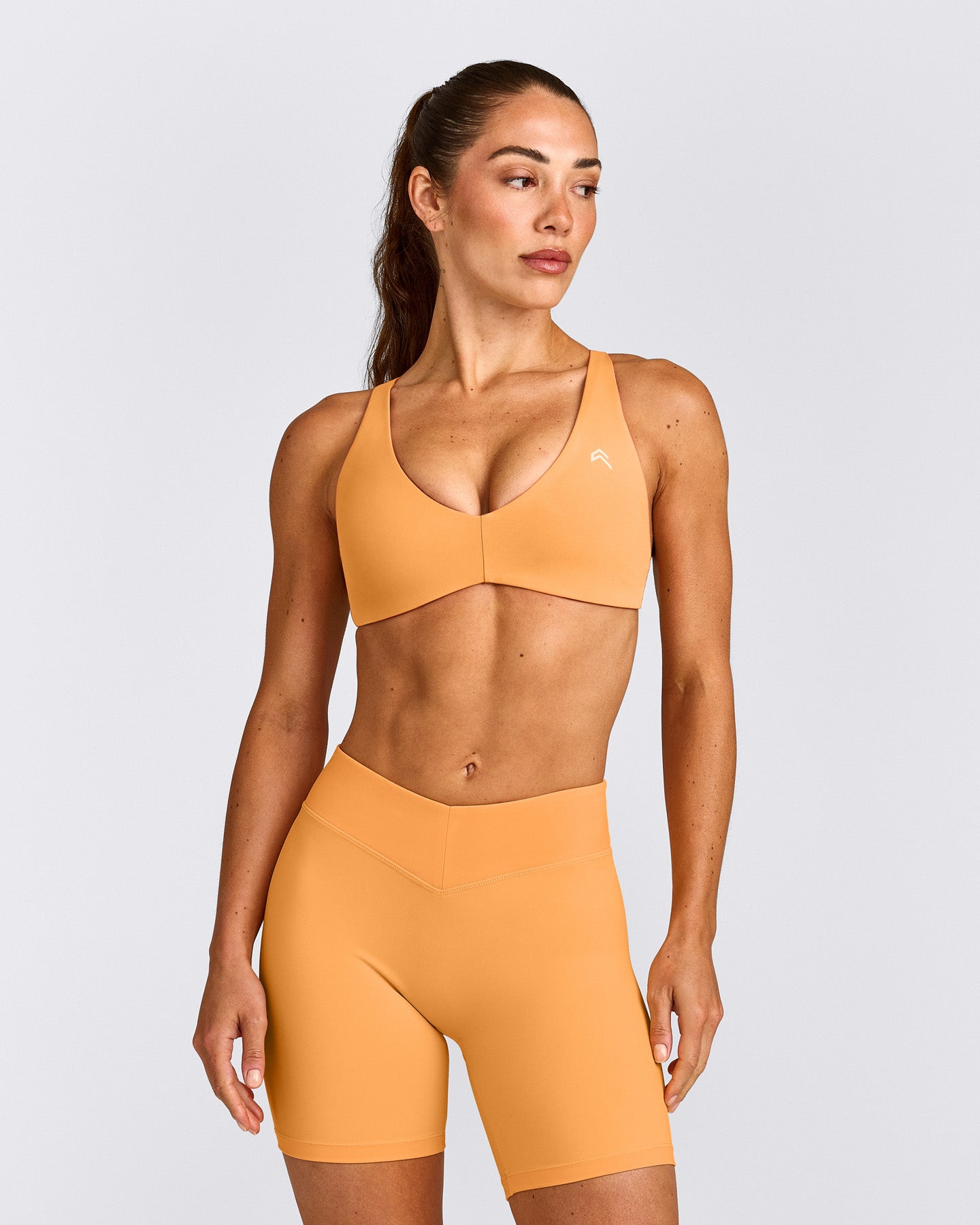 UnifiedMove™ Cross Back Sports Bra with Reflective Logo | Powdered Orange
