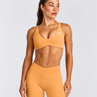 UnifiedMove™ Cross Back Sports Bra with Reflective Logo | Powdered Orange