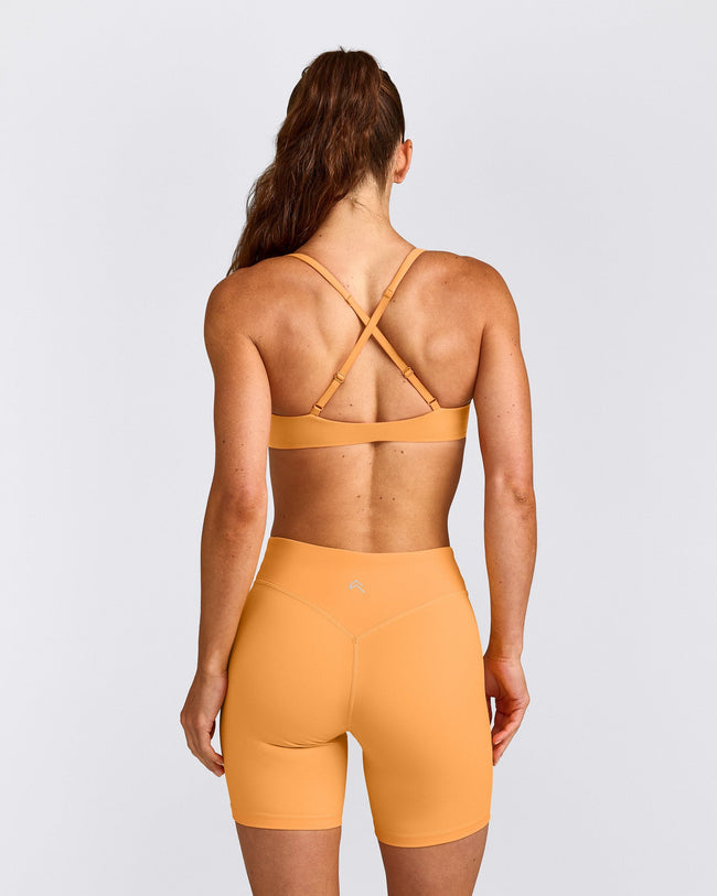 UnifiedMove™ Cross Back Sports Bra with Reflective Logo | Powdered Orange