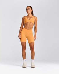 UnifiedMove™ Cross Back Sports Bra with Reflective Logo | Powdered Orange