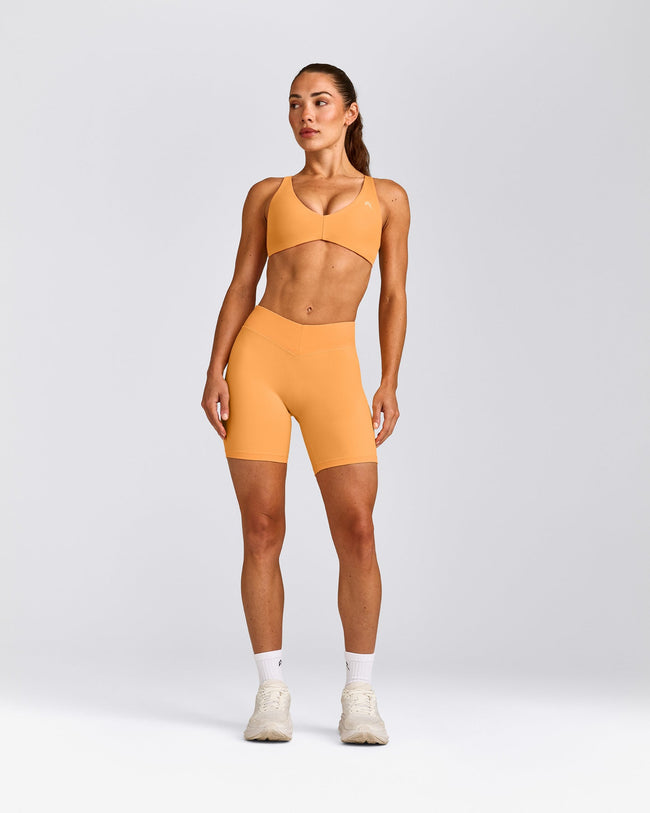 UnifiedMove™ Cross Back Sports Bra with Reflective Logo | Powdered Orange