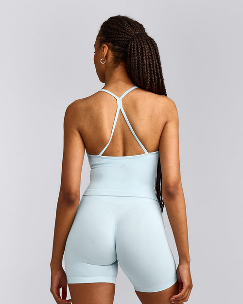 EnhanceLift™ Seamless Strappy Racer Vest with Built in Bra Shelf with Grey Logo | Cloud Blue