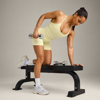 EnhanceLift™ Seamless Strappy Racer Vest with Built in Bra Shelf with Grey Logo | Pastel Yellow