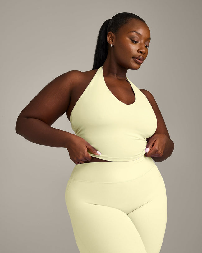 SoftMotion™ Halter Neck Mid Vest with Built in Bra Shelf with Grey Logo | Pastel Yellow