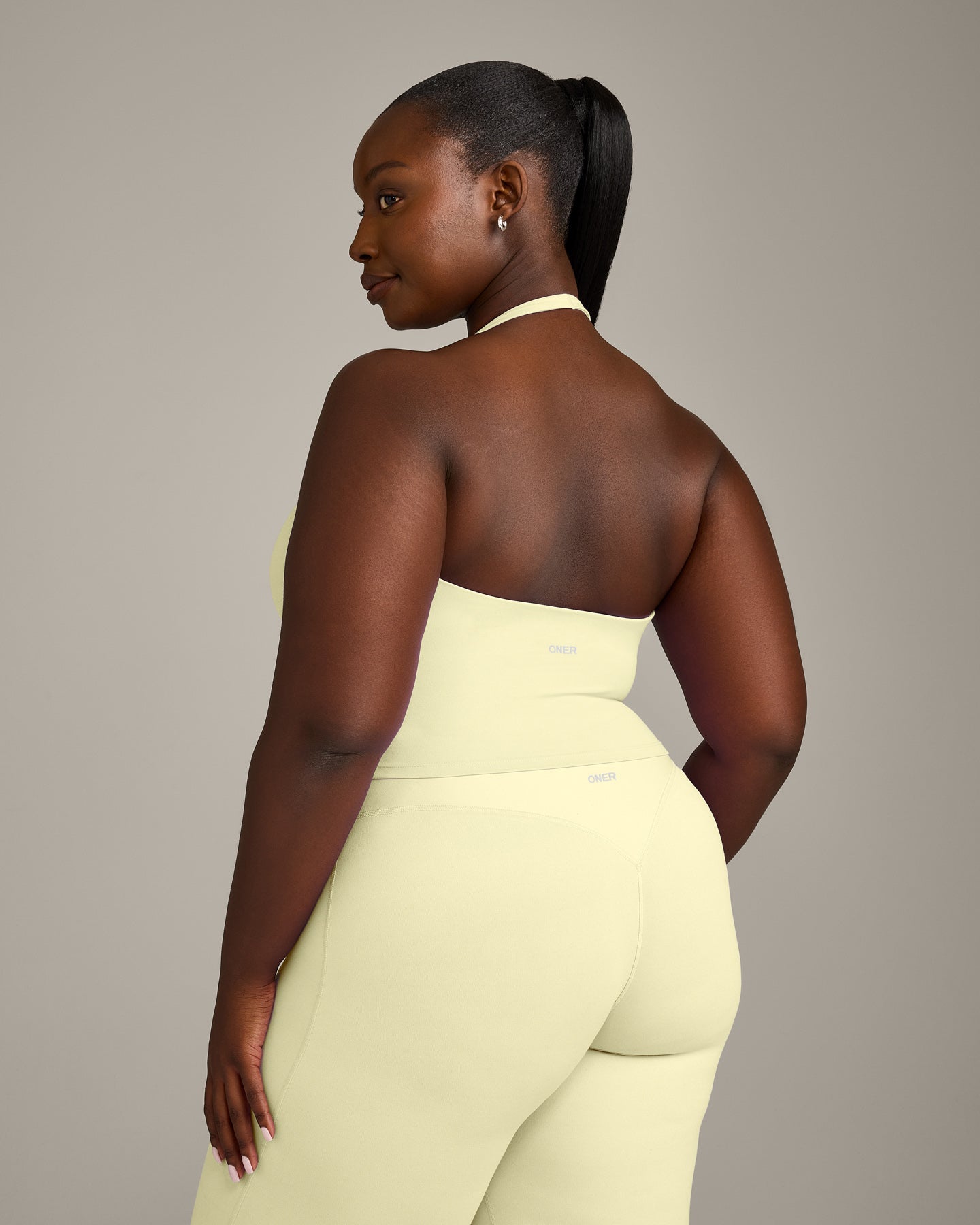 SoftMotion™ Halter Neck Mid Vest with Built in Bra Shelf with Grey Logo | Pastel Yellow