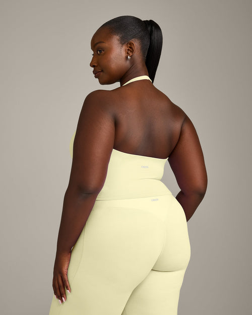 SoftMotion™ Halter Neck Mid Vest with Built in Bra Shelf with Grey Logo | Pastel Yellow