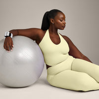 SoftMotion™ Halter Neck Mid Vest with Built in Bra Shelf with Grey Logo | Pastel Yellow