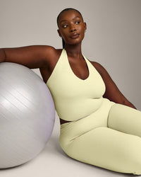 SoftMotion™ Halter Neck Mid Vest with Built in Bra Shelf with Grey Logo | Pastel Yellow